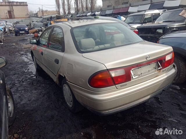 Фонарь задний левый. Mazda 323. BA.1994-2000г