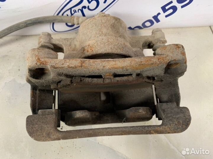 Суппорт передний левый Nissan X-Trail T31 2.0