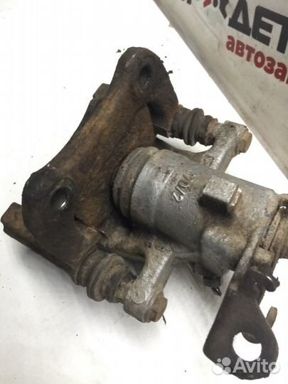 Суппорт тормозной задний правый Renault Megan 2