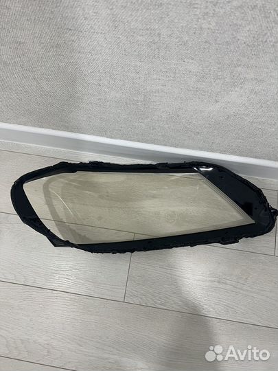 Стекло левой фары Volkswagen Passat B7