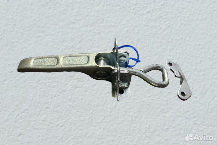 Защелка опракидования для кузова бортового прицепа