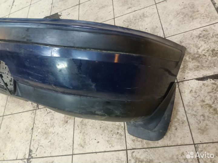 Задний бампер Mazda 323 BG слепая