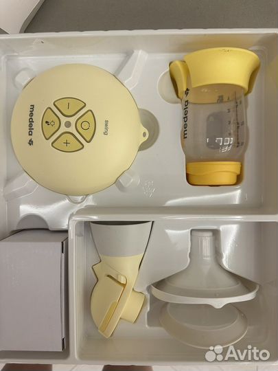 Молокоотсос medela электрический