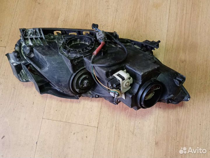 Фара левая Mazda Cx-7 EH1151040