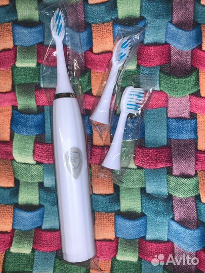Электрическая зубная щетка
