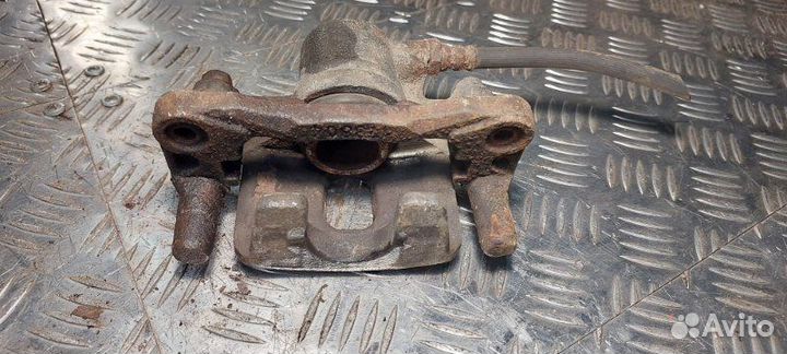 Суппорт тормозной передний левый Mitsubishi Lancer