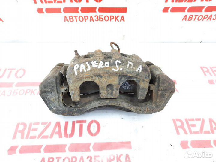Суппорт тормозной передний левый Mitsubishi Pajero