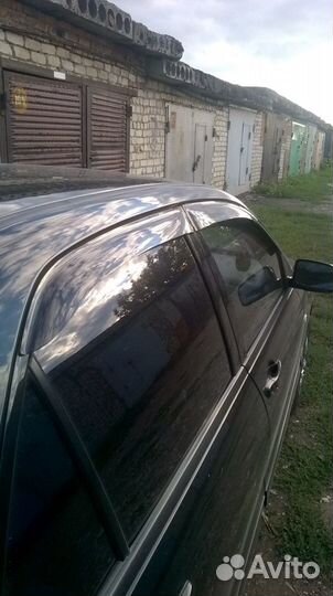 Дефлекторы на окна Lancer 9