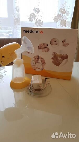 Молокоотсос medela электрический