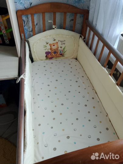 Детская кроватка с продольным маятником