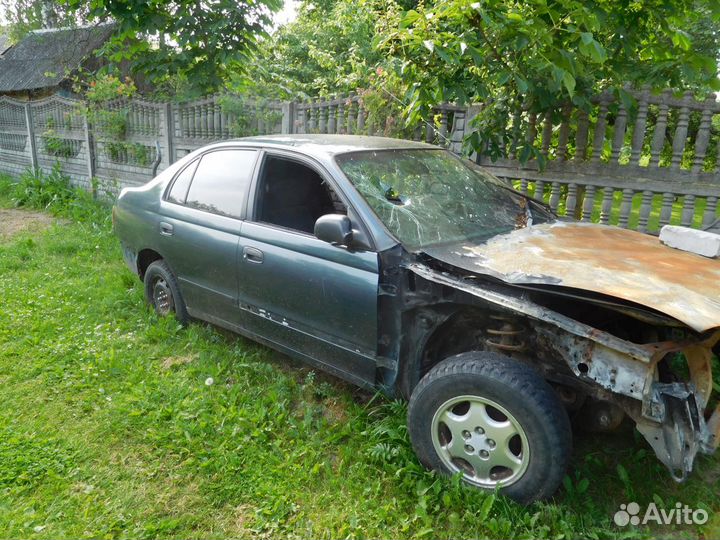 Тойота карина Е