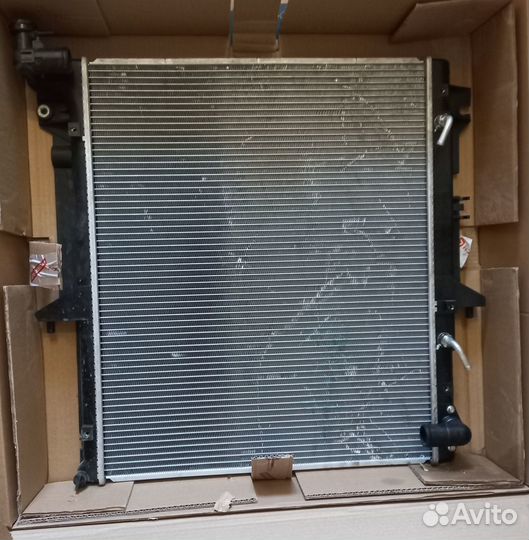 Радиатор охлаждения MI L200 2,5D АКПП 05