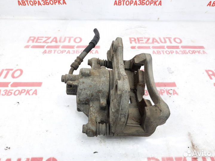 Суппорт тормозной передний правый Nissan Primera