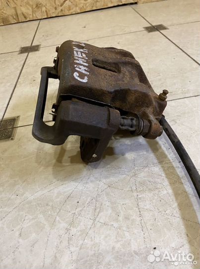 Тормозной суппорт перед лев SsangYong Kyron