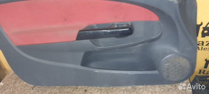 Обшивка двери левая Opel Corsa D 1.4L 2007