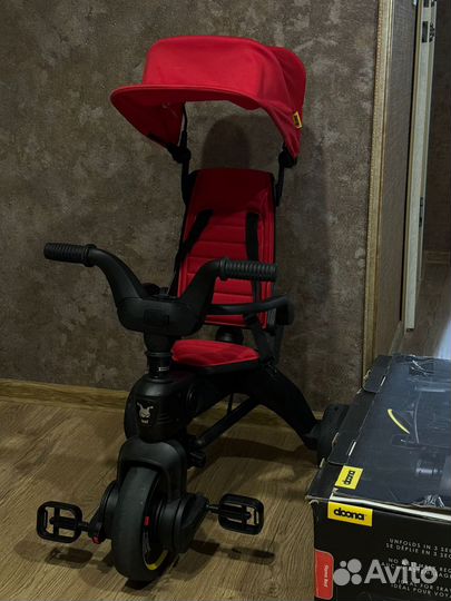 Детский велосипед с ручкой doona liki trike