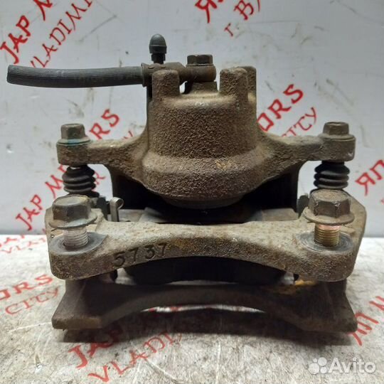 Суппорт тормозной передний левый Mitsubishi Lancer