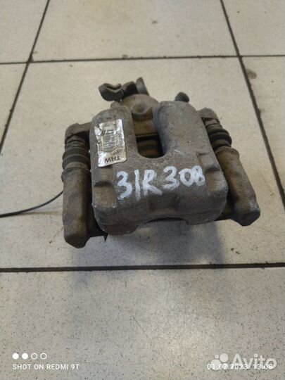 Суппорт тормозной задний правый Peugeot 308