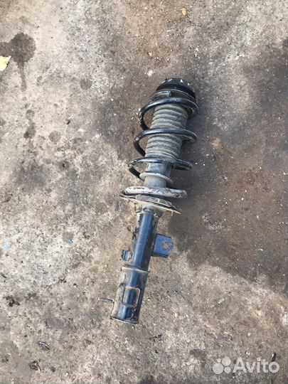 Стойка амортизатора передняя левая Kia Rio, III