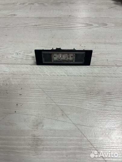 Фонарь подсветки номера на Bmw F20