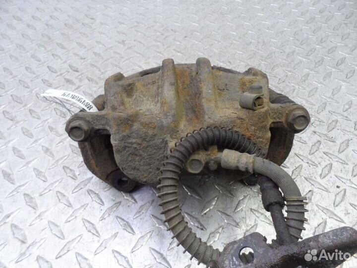 Суппорт передний левый Hyundai Santa Fe 2 CM