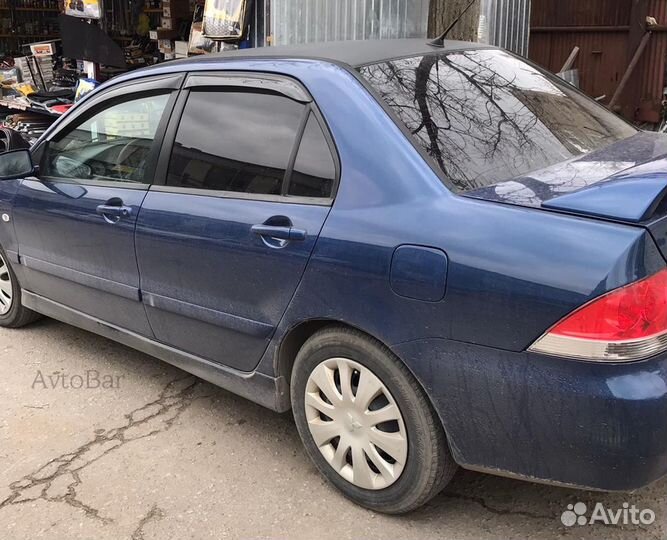 Дефлекторы на окна Lancer 9