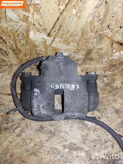 Суппорт тормозной задний левый Toyota Camry XV40