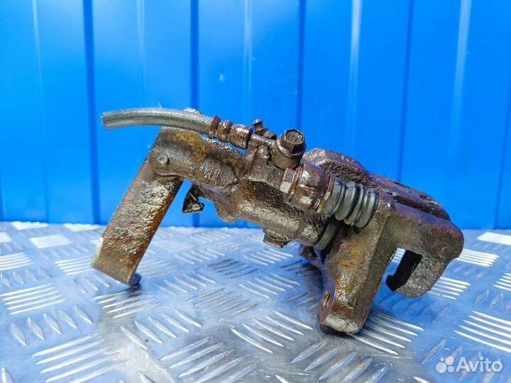 Суппорт задний правый Nissan Almera N16 1.5 QG15DE