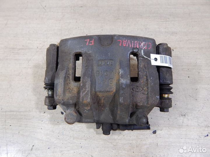 Суппорт тормозной передний левый Kia Carnival VQ