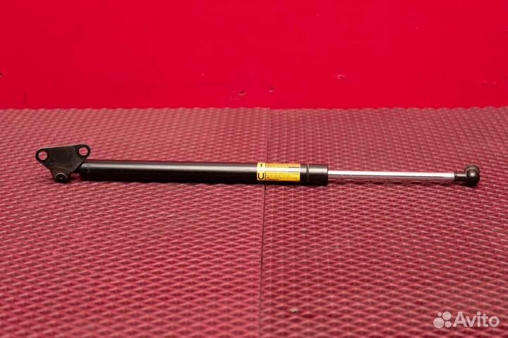 Амортизатор крышки багажника правый Toyota Land