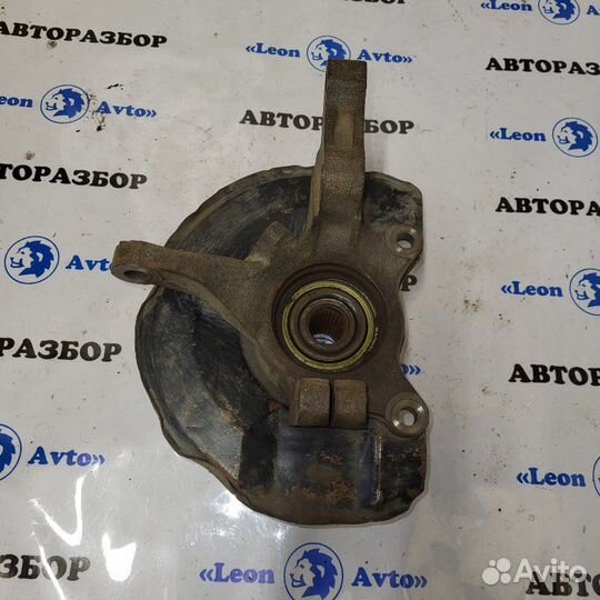 Поворотный кулак передний левый Mitsubishi Lancer