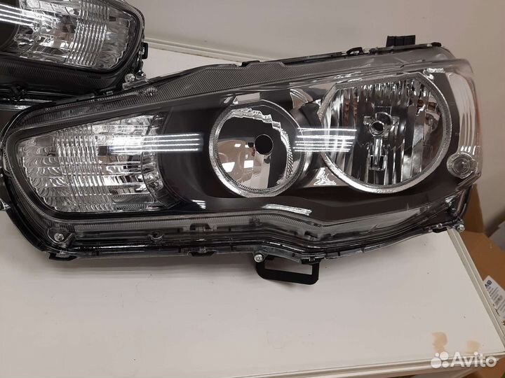 Фара левая Mitsubishi lancer 10