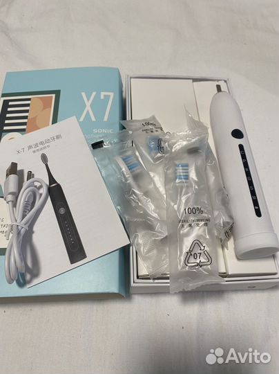 Электрическая зубная щетка