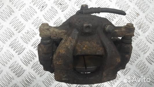 Суппорт тормозной передний левый toyota avensis T2