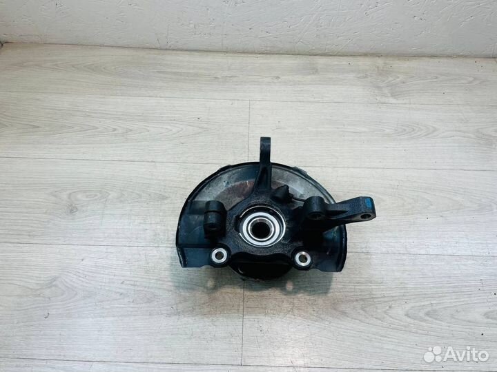 Кулак передний левый Mitsubishi Lancer 10