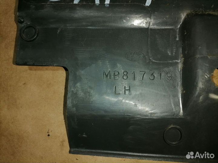 Обшивка багажника лево Митсубиси Лансер 8