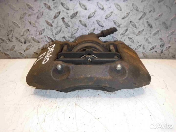 Суппорт тормозной передний левый Mazda Demio