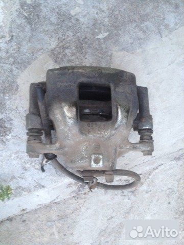 Суппорт передний правый Toyota Corolla E170