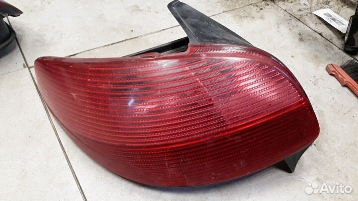 Фонарь левый Peugeot 206