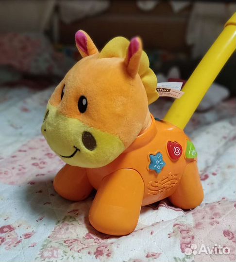 Музыкальная игрушка-каталка