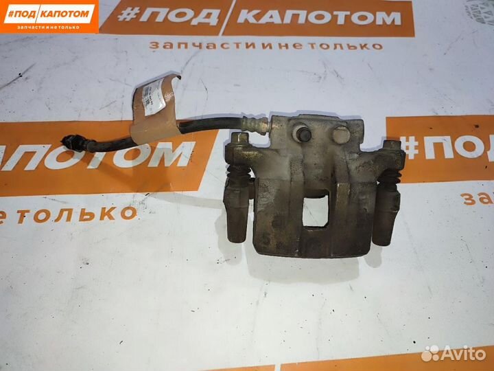 Суппорт тормозной задний левый Mitsubishi Lancer