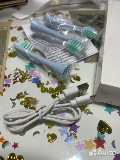 Электрическая зубная щетка