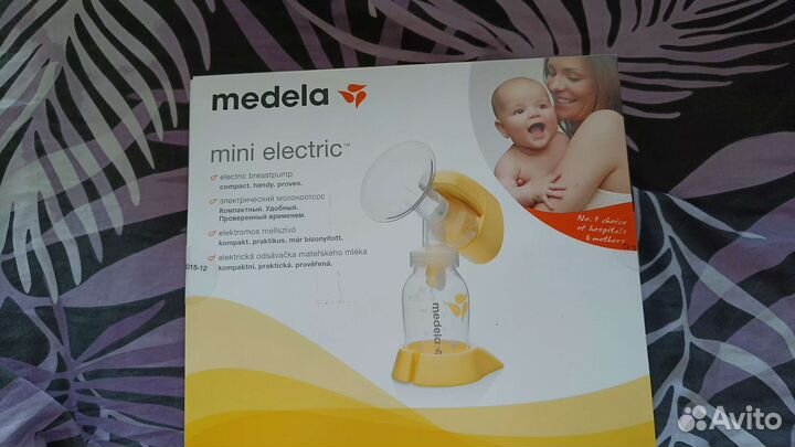 Молокоотсос medela электрический