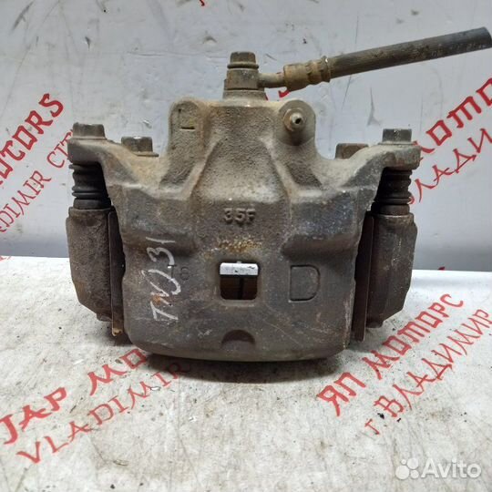 Суппорт тормозной передний левый Nissan Teana J32