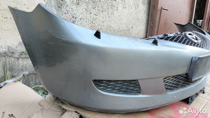 Передний бампер Mazda 6 (02-05) дорест