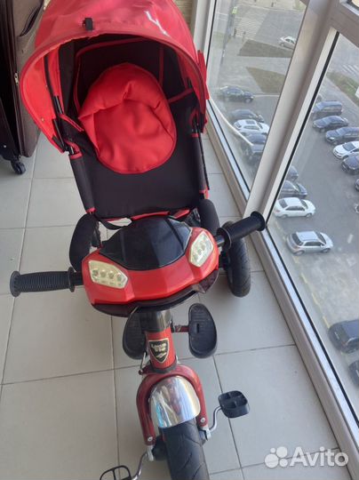 Трехколесный велосипед с ручкой