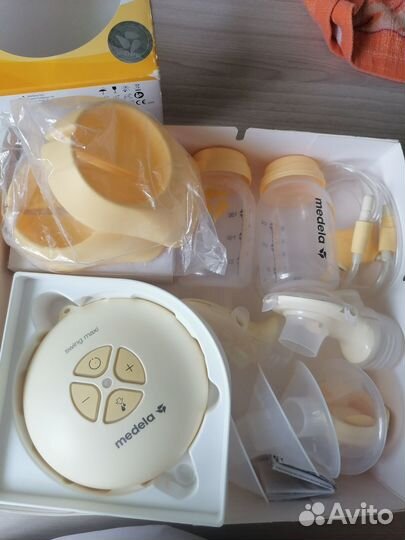 Молокоотсос medela электрический