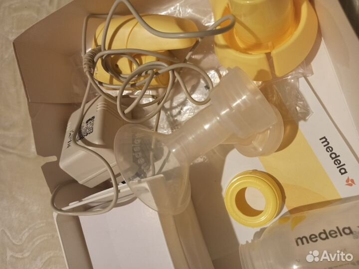 Молокоотсос medela электрический