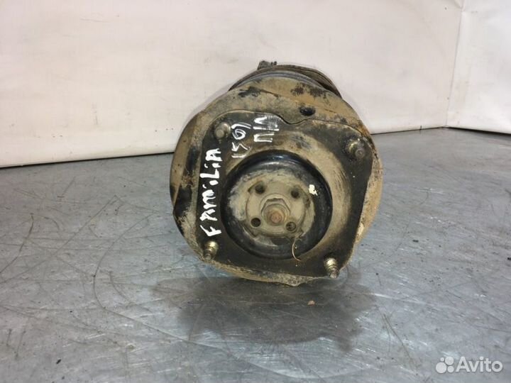 Стойка подвески передняя левая Mazda Familia седан