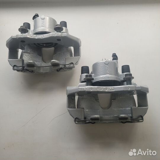 Суппорт тормозной передний Форд Фокус 2